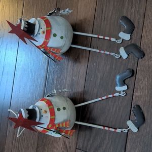 Like new pair of metal snowman ornaments